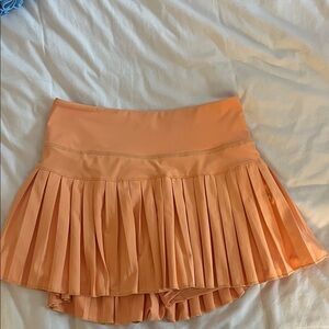 Pleated Orange Skirt